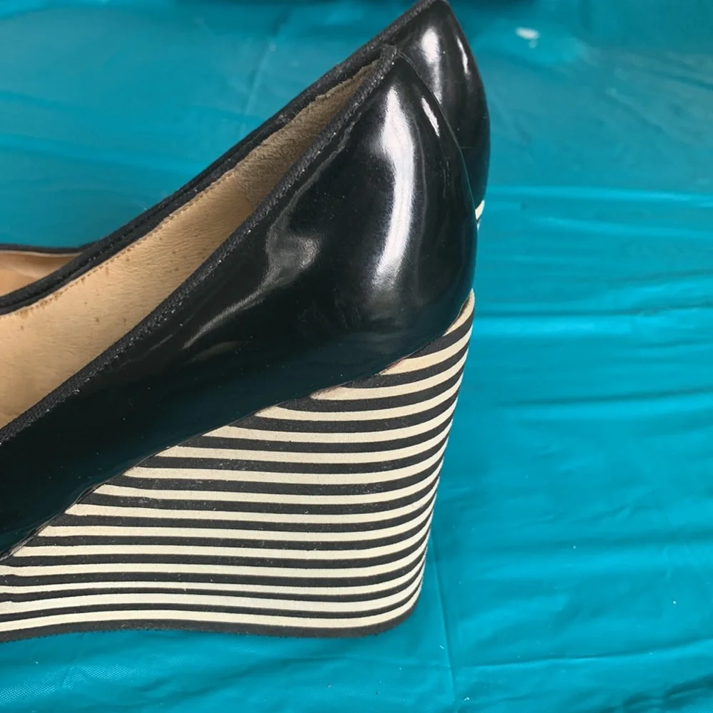 Gently worn Michael Kors Adlai’s Black and Cream Strip Wedge Shoes.